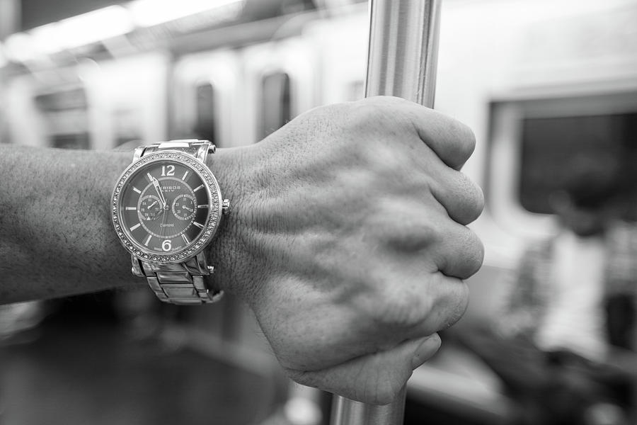 Black And White Photograph - Watch on the Subway  by John McGraw