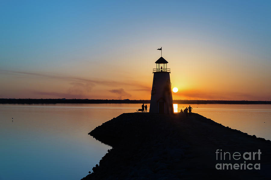 Sunset Photograph - Watching the sunset under the lighthouse by Paul Quinn