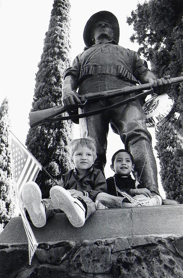 Watching Veterans Day parade on Spanish American War statue Tucson AZ 1986 Photograph by David Lee Guss