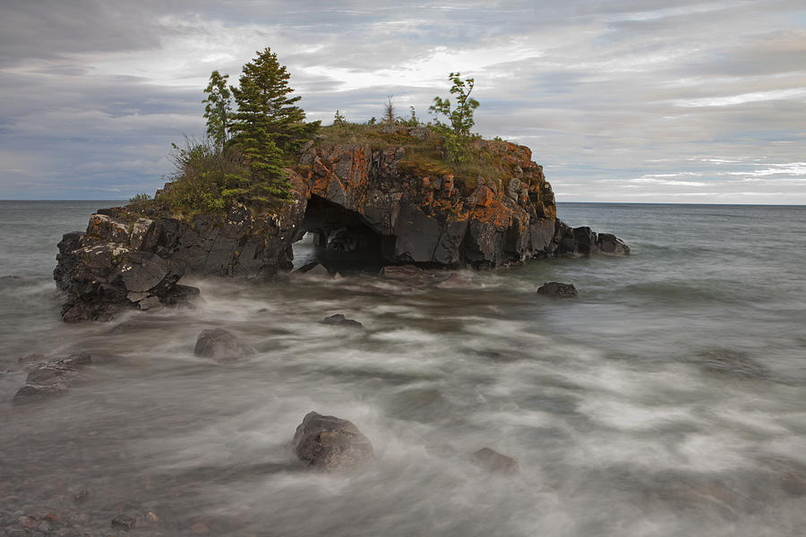 Water Coming Into Shore Around A Rock Photograph by Susan Dykstra