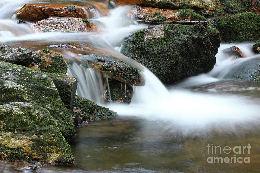 Water flowing over rocks - long exposure Photograph by Michal Boubin