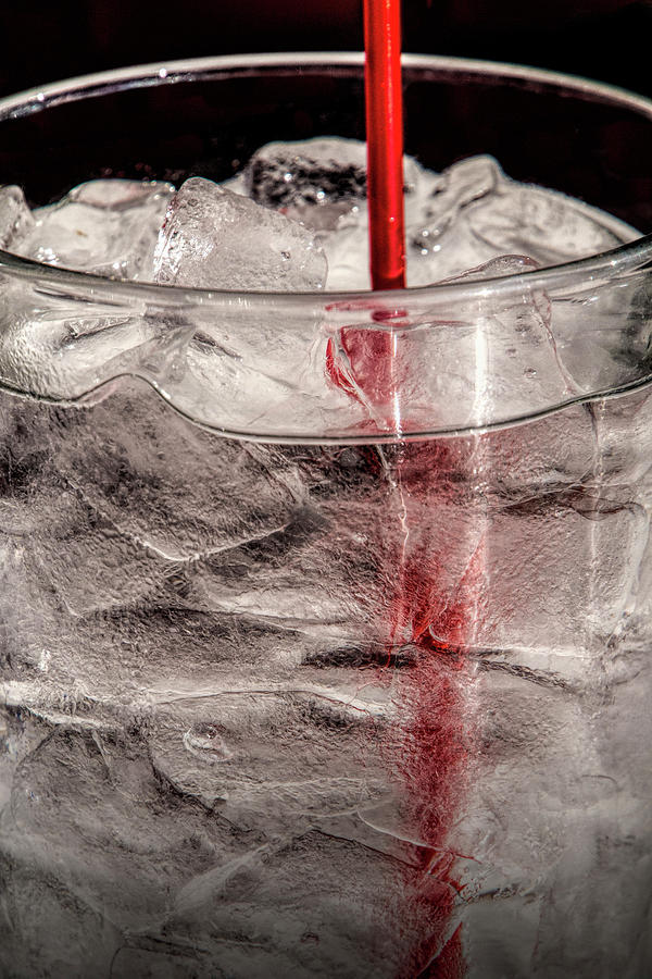 Water Glass with Ice and a Red Straw Photograph by Randall Nyhof