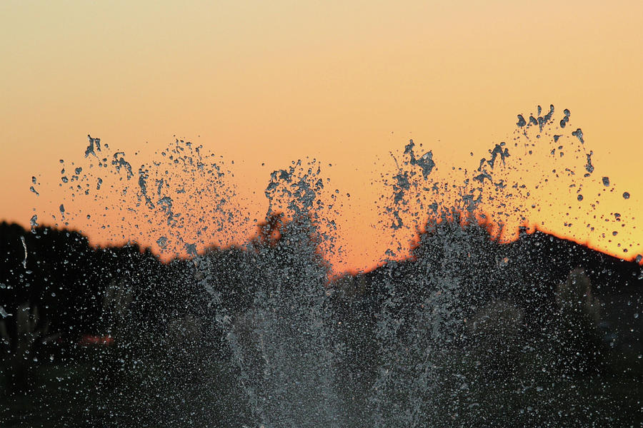 Water Play At Sunset Photograph by DiDesigns Graphics