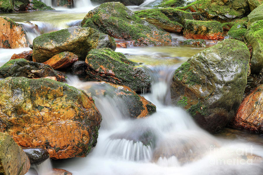 Water running over rocks - long exposure Photograph by Michal Boubin