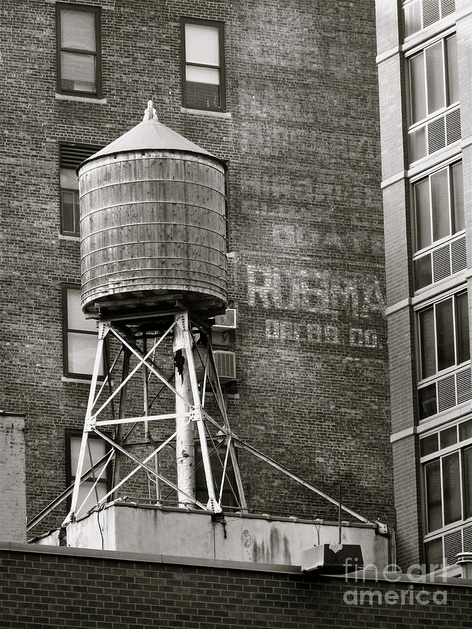 Water Tank with Ghost Sign Photograph by Maritza Melendez