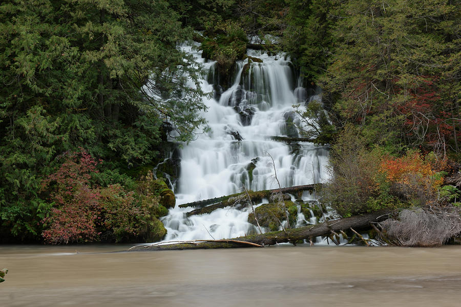 Waterfall flowing into the Klickatat river Photograph by Jeff Swan