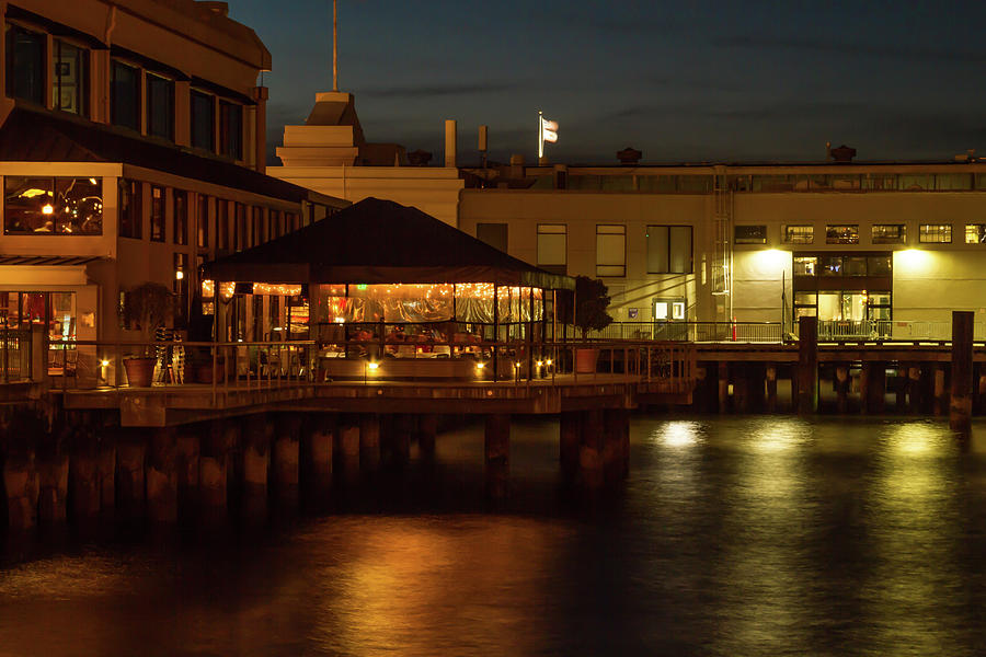 Waterfront Restaurant at Night Photograph by Bonnie Follett