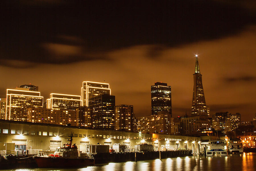 Waterfront Skyline At Night Photograph by Bonnie Follett