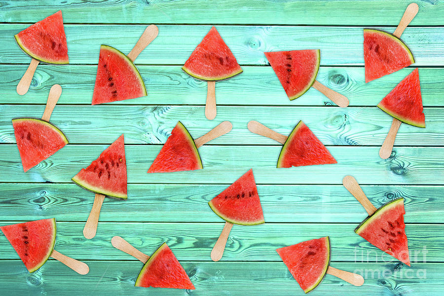 Watermelon popsicles on blue Photograph by Delphimages Photo Creations