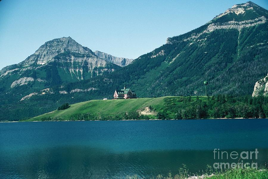 Mountain Photograph - Waterton Lake hotel with Glacier mountains by Bill Setliff