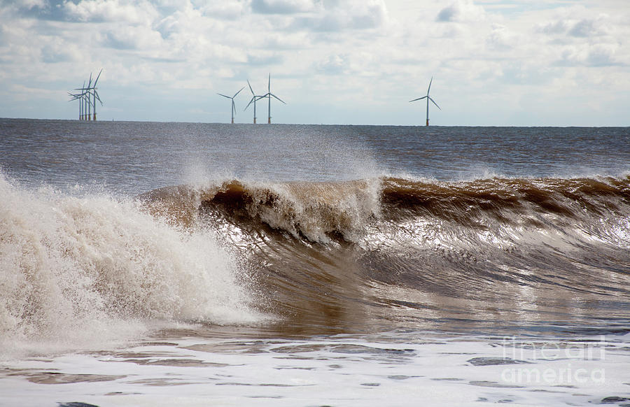Waves Breaking Against The Beach With Wind Farm In The Background Skegness Lincolnshire England Photograph