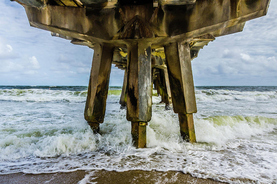 Waves hit the pier Photograph by Wolfgang Stocker