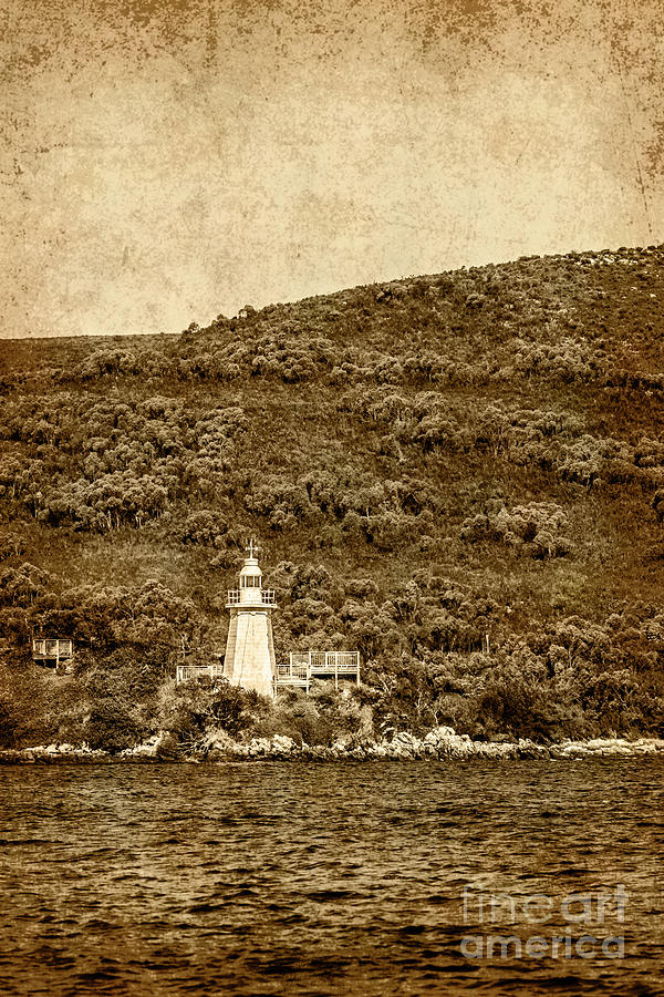 Weathered antique lighthouse Photograph by Jorgo Photography
