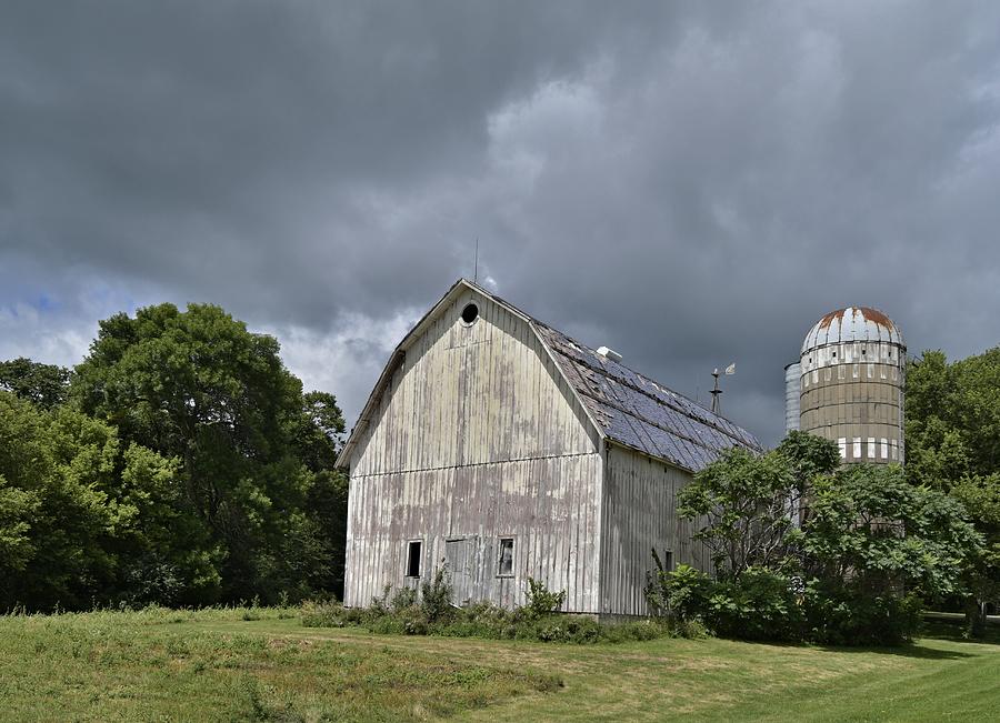 Weathered Barn and Silo under a cloudy sky by Steven Liveoak Weathered Barn and Silo under a cloudy sky by Steven Liveoak