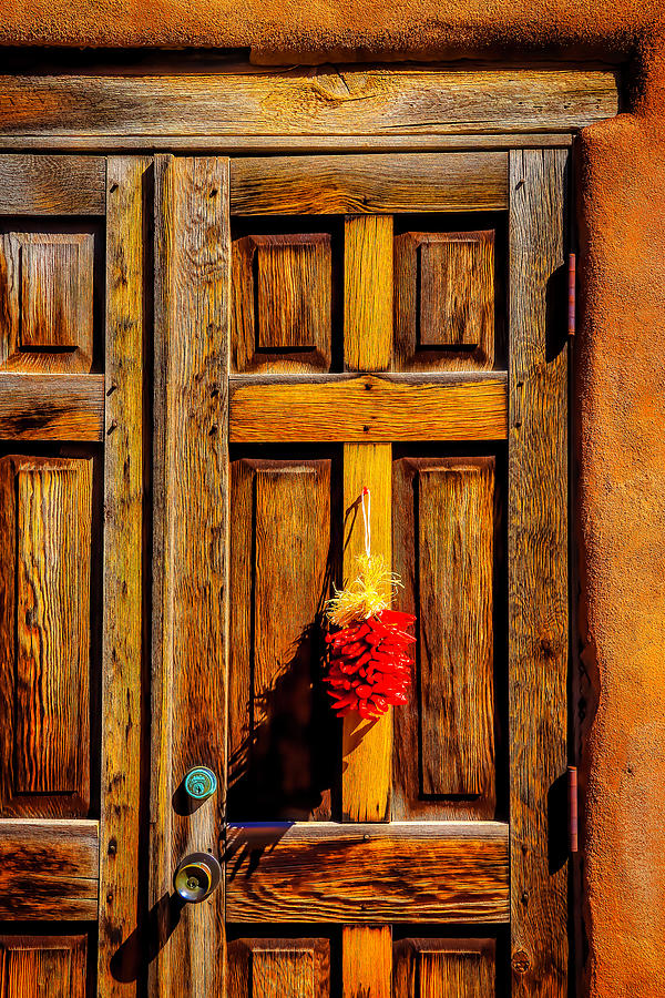 Weathered Door With Chillies Photograph by Garry Gay