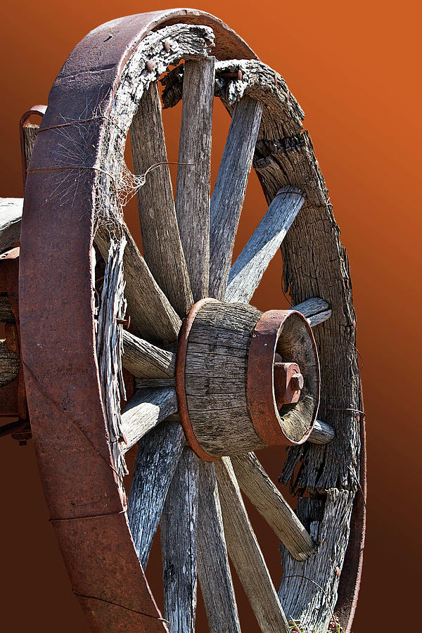 Weathered Wagon Wheel  Photograph by Phyllis Denton