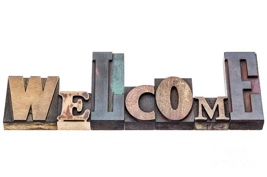 Welcome sign in mixed wood type Photograph by Marek Uliasz