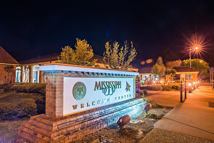 Welcome To Mississippi Visitor Center Rest Area Sign At Night Photograph by Alex Grichenko