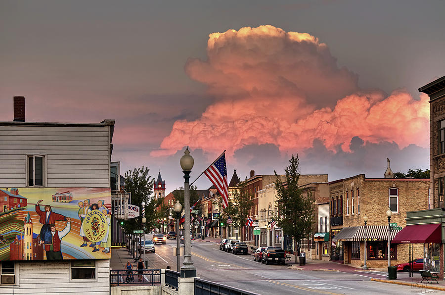 Welcome to Stoughton - heritage mural and main street with cumulonimbus stormcloud in background Photograph by Peter Herman