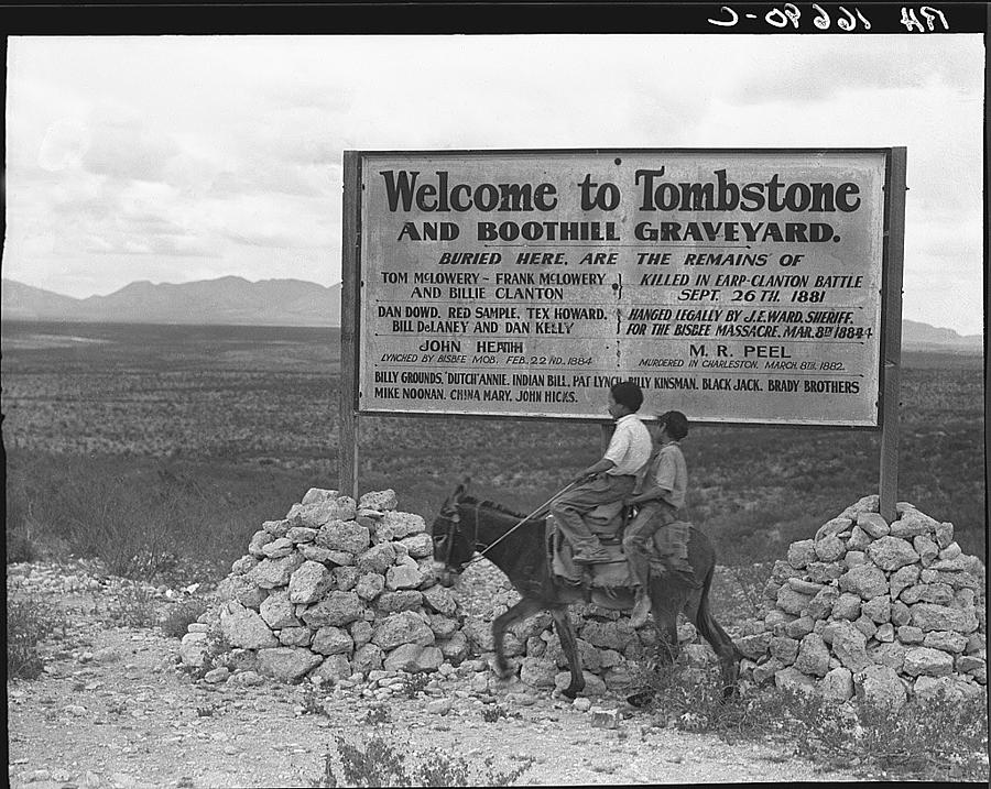 Welcome to Tombstone sign children riding burro c.1940 Photograph by David Lee Guss