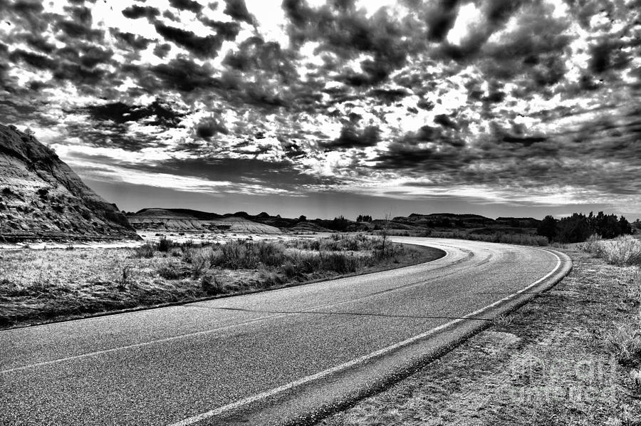 Where the road turns black and white Photograph by Jeff Swan