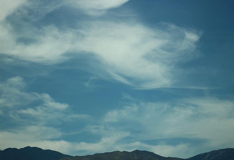 Whispy Clouds Over Dark Mountain Tops Photograph by Colleen Cornelius