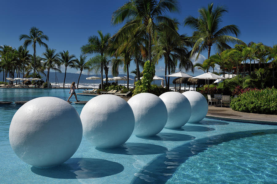 White balls in resort pool of Vidanta in Nuevo Vallarta Mexcio Photograph by Reimar Gaertner