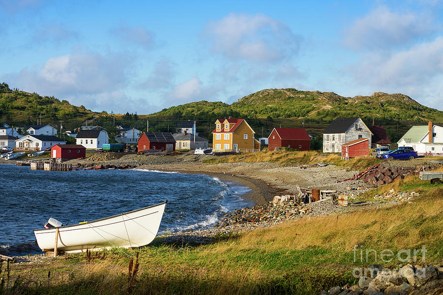 White boat on a rocky beach in Twillingate Photograph by Les Palenik