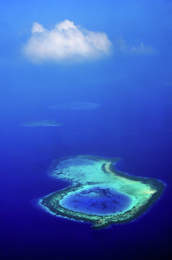 White Cloud Over Coral Reef. Aerial Journey Around Maldives Photograph by Jenny Rainbow