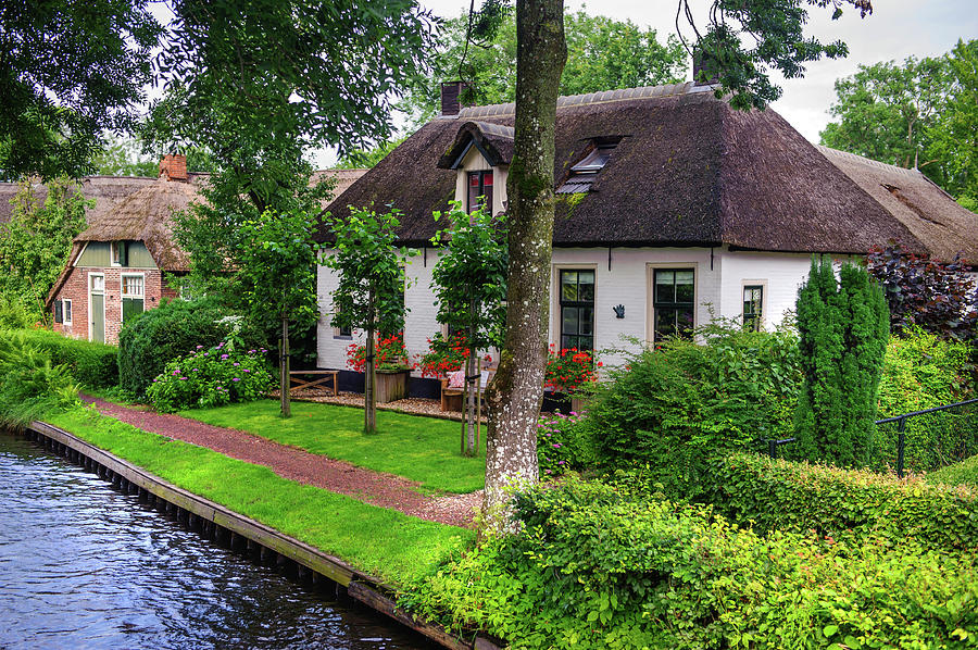 White Cottages at the Canal in Giethoorn. The Netherlands Photograph by Jenny Rainbow