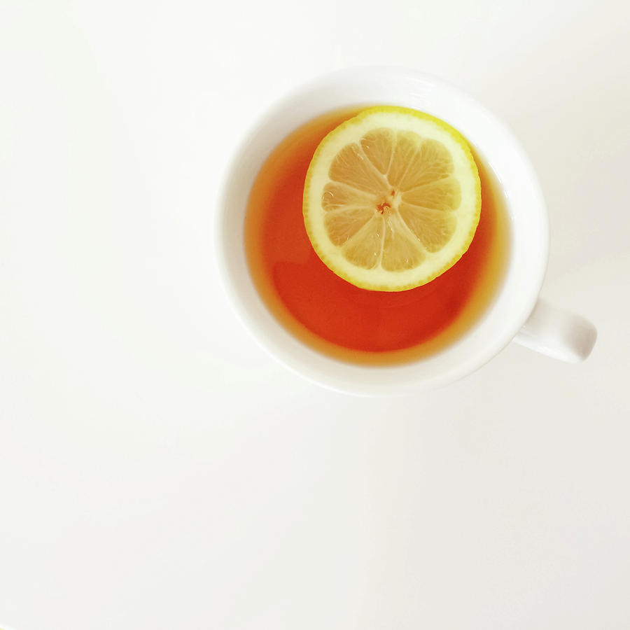 Tea Photograph - White cup of tea with lemon by GoodMood Art
