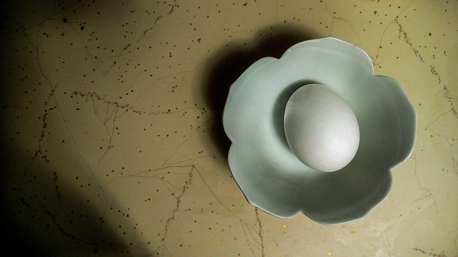 White  egg in white bowl Photograph by Jeff Kurtz