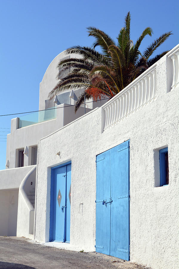 White House With Blue Doors In Santorini Greece Photograph By