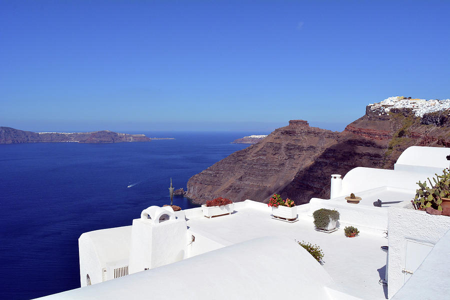 White houses in Santorini, Greece and the blue Aegean Sea. Photograph ...