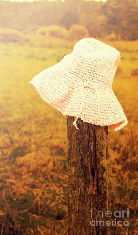 White Knitted Hat On Farm Fence Photograph
