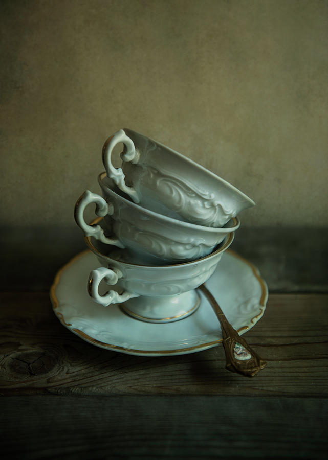 Cup Photograph - White ornamented teacups by Jaroslaw Blaminsky