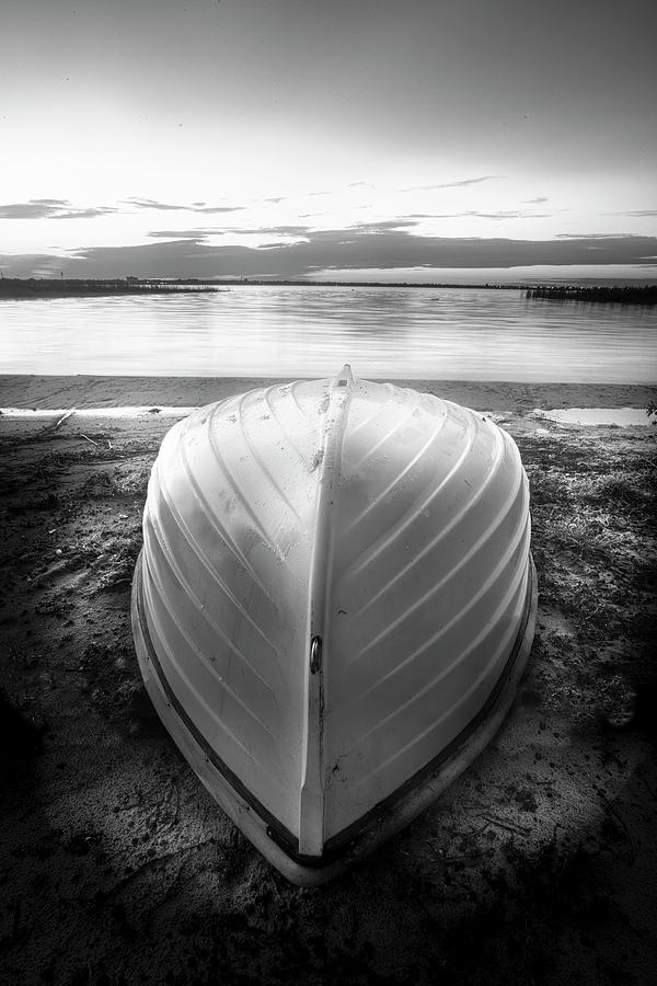 White Rowboat Waiting for Sunrise  in Black and White Photograph by Debra and Dave Vanderlaan