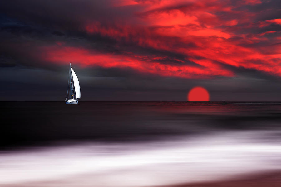 White sailboat and red sunset Photograph by Philippe Sainte-Laudy