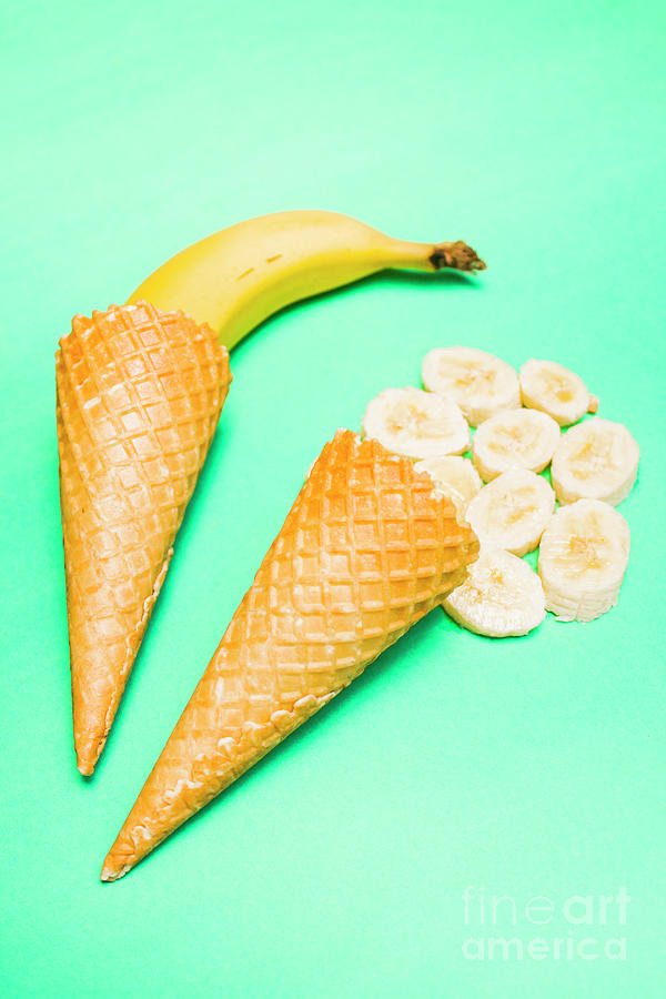 Ice Cream Photograph - Whole bannana and slices placed in ice cream cone by Jorgo Photography