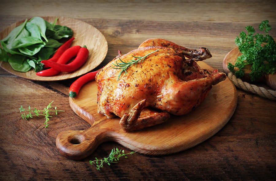Roasted Chicken On Wooden Cutting Board Stock Photo, Picture and Royalty  Free Image. Image 46728169.