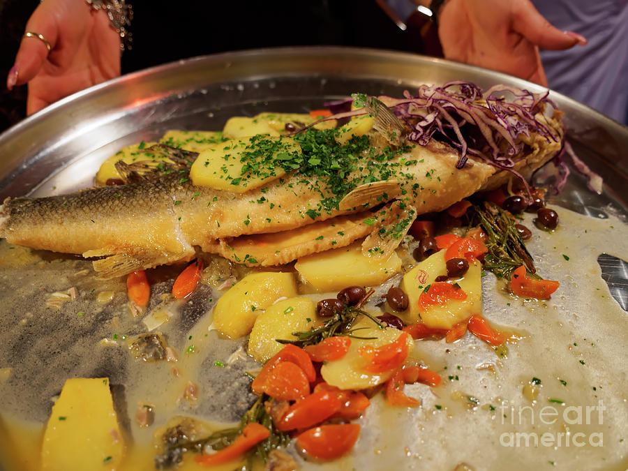 Whole sea bass with vegetables Photograph by Louise Heusinkveld