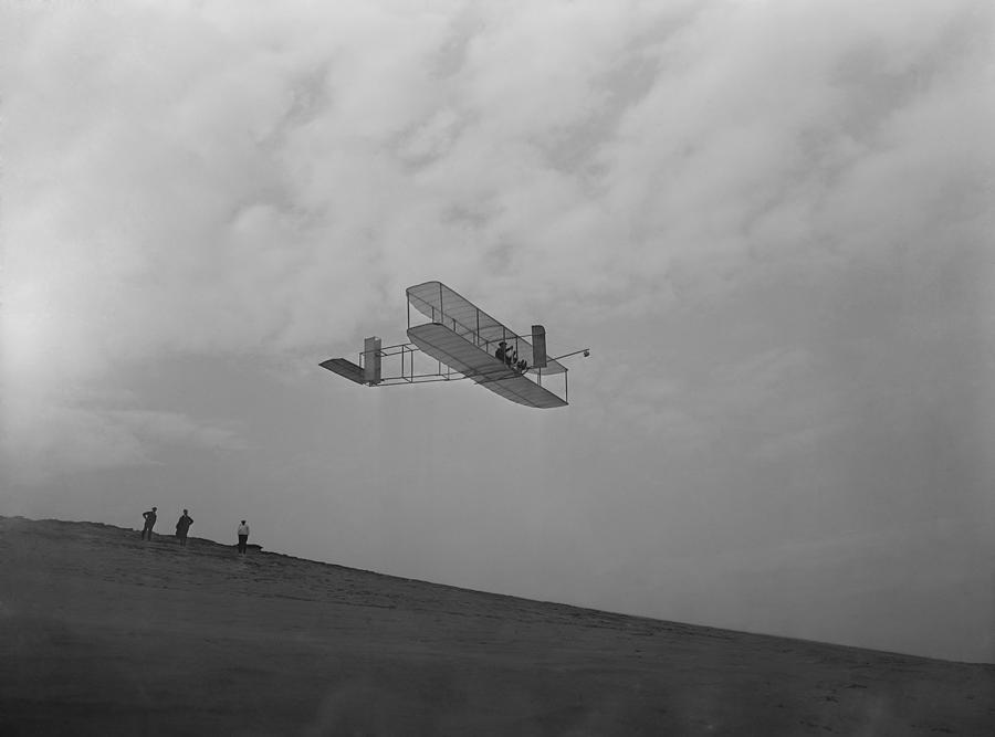 Portrait Photograph - Wilbur Wright Pilots A Glider by Everett
