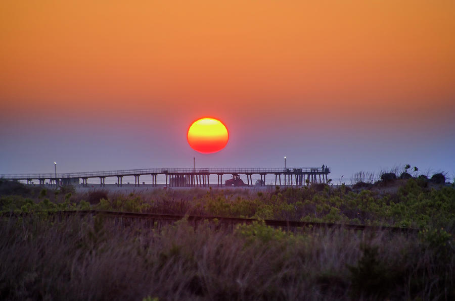 Wildwood Crest Pier - Big Red Sun Photograph by Bill Cannon