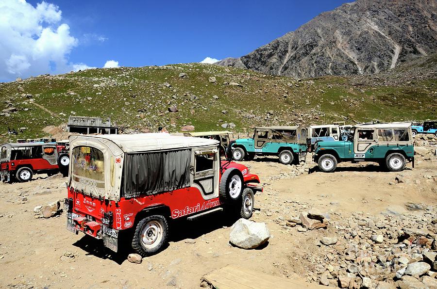 Willys jeeps parked on mountainside valley in Pakistan Photograph by Imran Ahmed