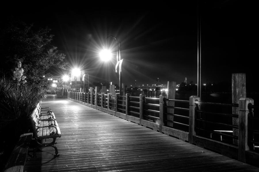Wilmington Riverwalk At Night in Black and White Photograph by Greg and Chrystal Mimbs