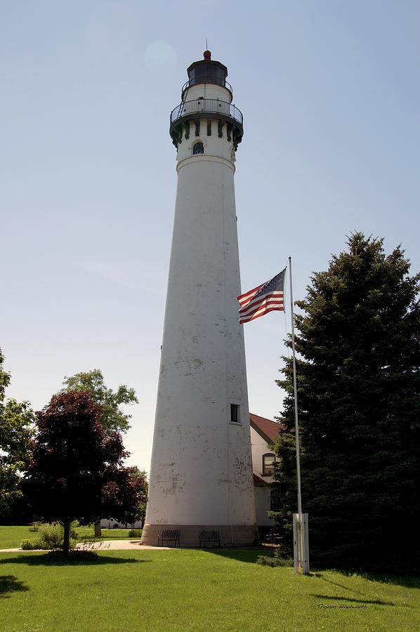 Wind Point LightHouse Racine Wisconsin Vertical With US Flag Photograph by Thomas Woolworth