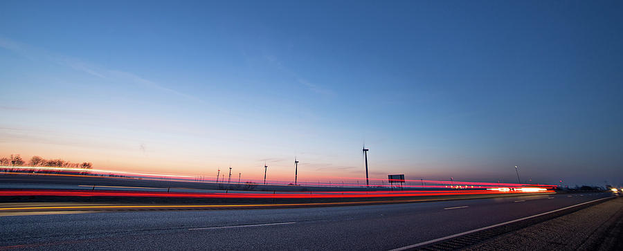 Wind Turbines At Sunset Along Highway Morning Commute Photograph by Alex Grichenko