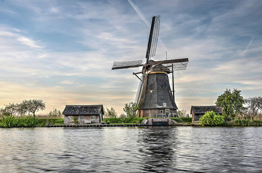Windmill and Canal in Kinderdijk Photograph by Frans Blok