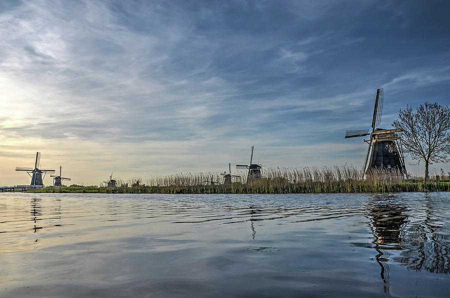 Windmill Reflecting in Kinderdijk Canal Photograph by Frans Blok