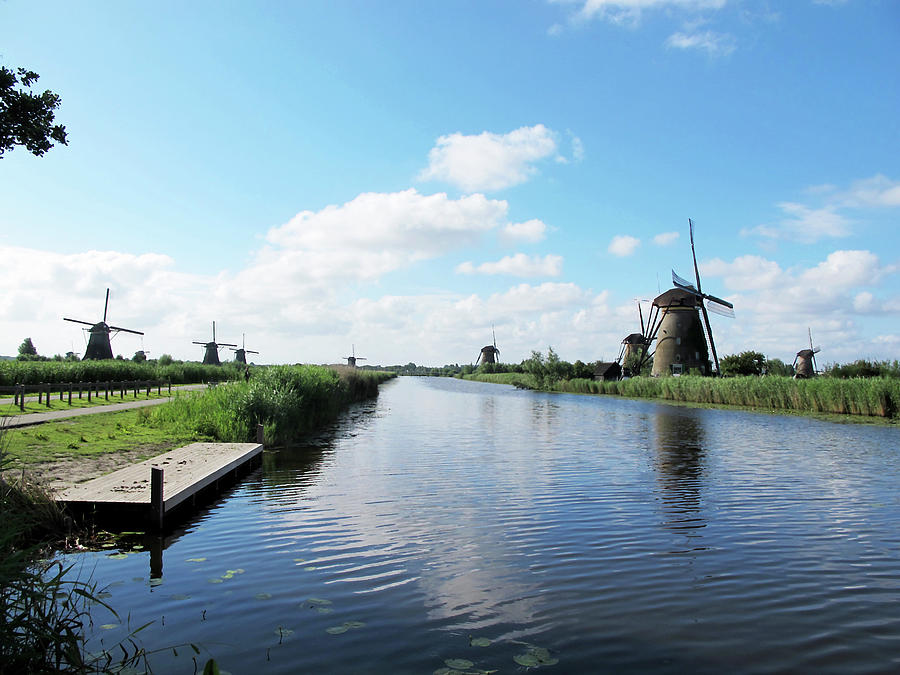 Windmills in Kinderdijk Holland Photograph by Loretta Luglio
